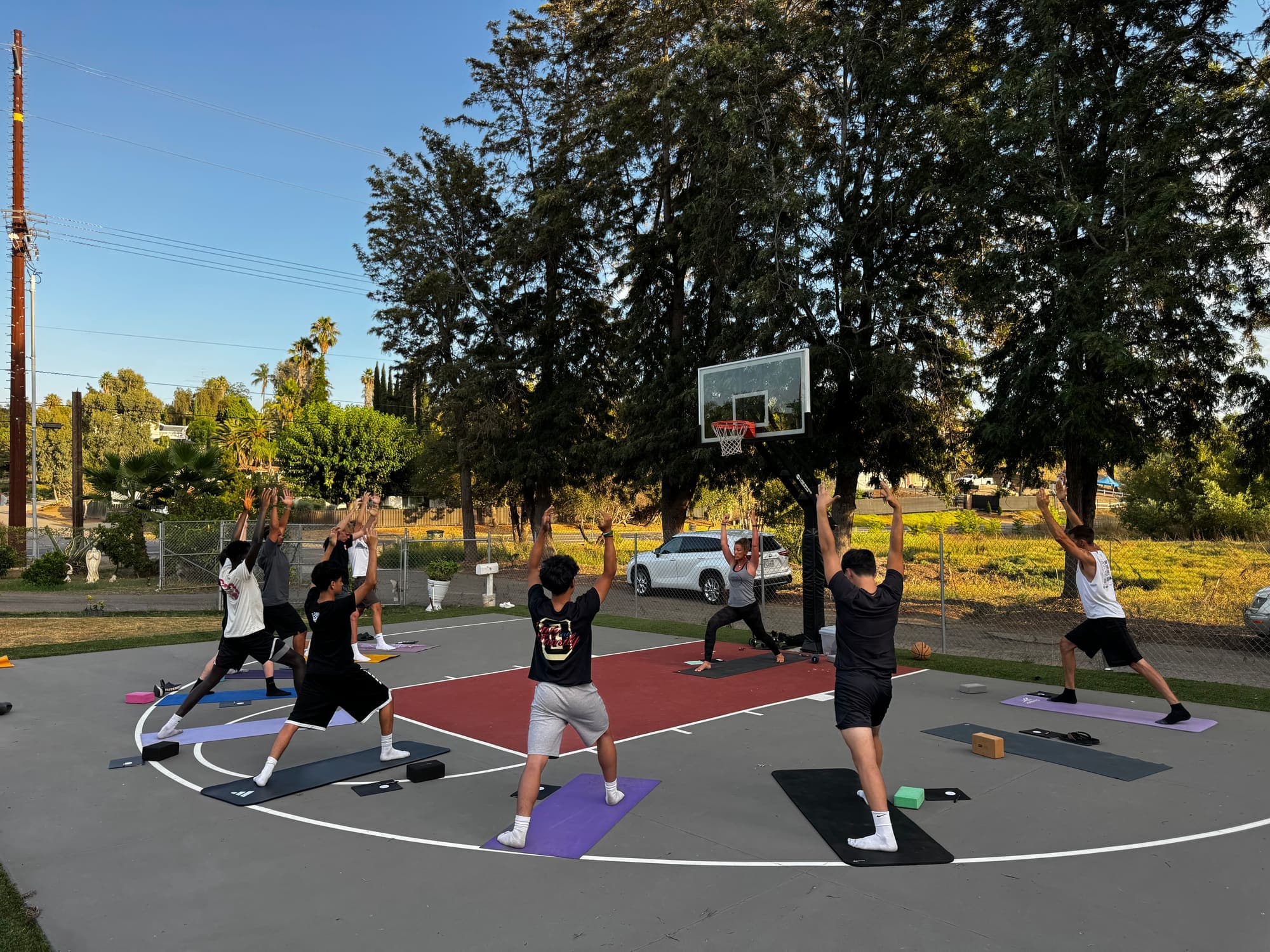 Athletes practicing on an outdoor court during a Mind Body Athletes session