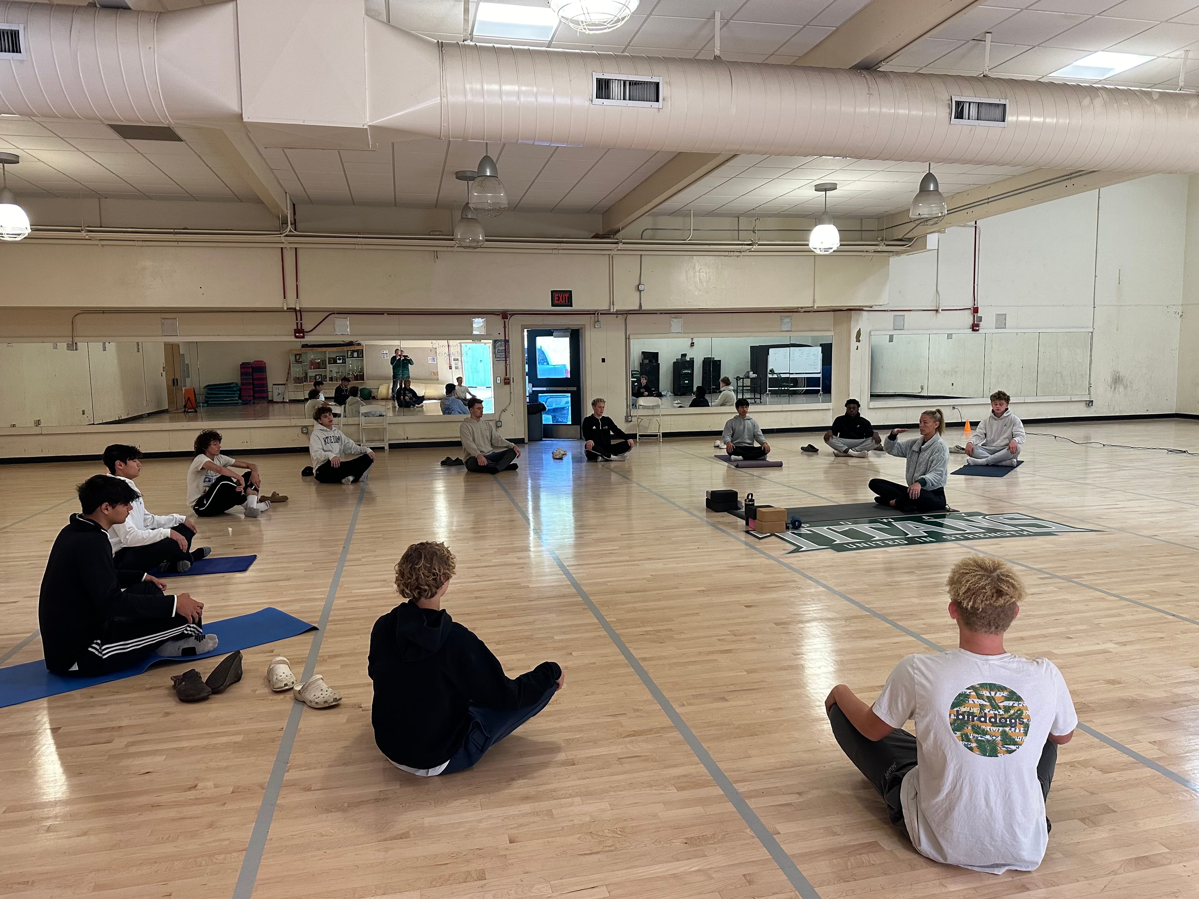 Allie Chapman leading a Titans team circle during a Mind Body Athletes workshop
